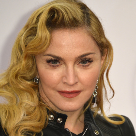 mr mrs madonna, Madonna poses for photographers on the red carpet on the opening event of the Fitness Center 'Hard Candy' on October 17, 2013 in Berlin.